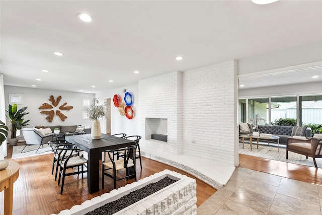 3309 Citation Dr, Dallas, TX 75229 - dining room featuring recessed lighting, a brick fireplace, and wood finished floors