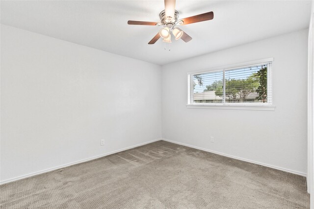 3309 Citation Dr, Dallas, TX 75229 - unfurnished room with carpet flooring, baseboards, and a ceiling fan