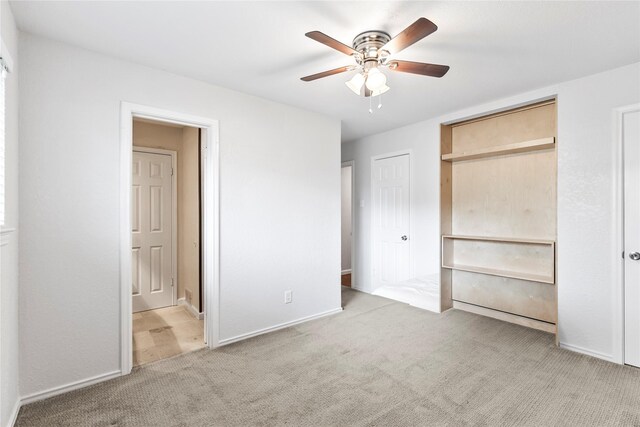 3309 Citation Dr, Dallas, TX 75229 - unfurnished bedroom featuring carpet floors, ensuite bath, baseboards, and ceiling fan