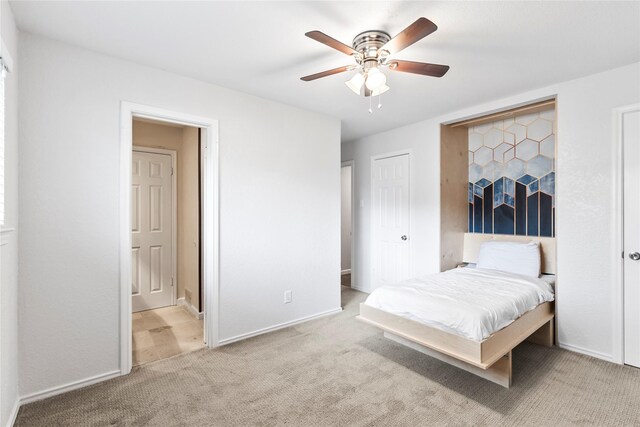 3309 Citation Dr, Dallas, TX 75229 - carpeted bedroom with baseboards and ceiling fan