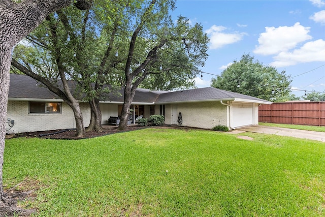 3309 Citation Dr, Dallas, TX 75229 - rear view of house featuring driveway, a garage, brick siding, and roof with shingles