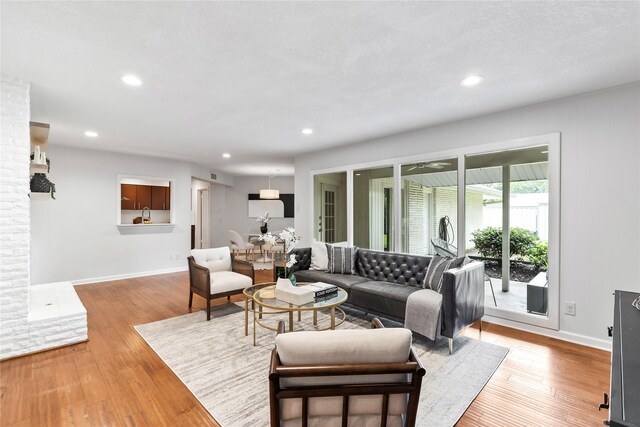 3309 Citation Dr, Dallas, TX 75229 - living room with wood finished floors, recessed lighting, and baseboards