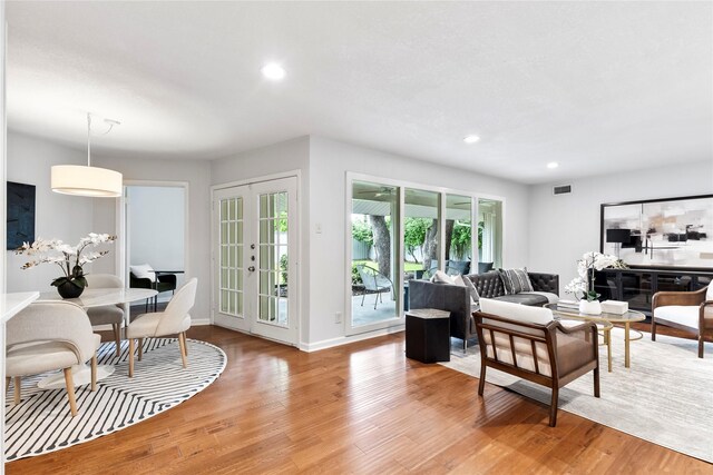 3309 Citation Dr, Dallas, TX 75229 - living room featuring light wood-style flooring, recessed lighting, and baseboards