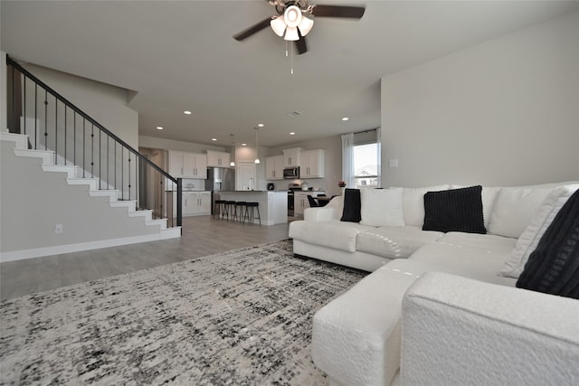 186 Dogwood Ave, Rhome, TX 76078 - living room with ceiling fan, light wood-style flooring, stairs, recessed lighting, and baseboards