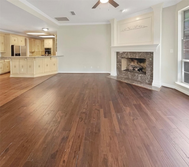 6029 Bellaire Dr, Benbrook, TX 76132 - unfurnished living room with a ceiling fan, crown molding, hardwood / wood-style flooring, and a high end fireplace
