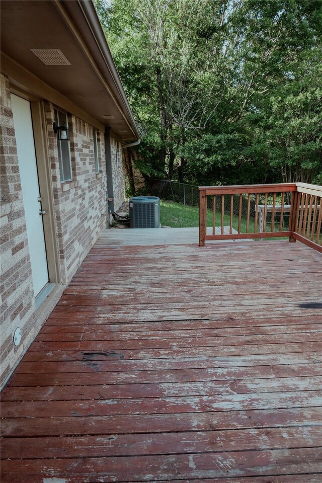 248 Ellis St, Rusk, TX 75785 - wooden deck featuring central AC