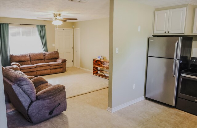 248 Ellis St, Rusk, TX 75785 - living room featuring ceiling fan, baseboards, and light carpet