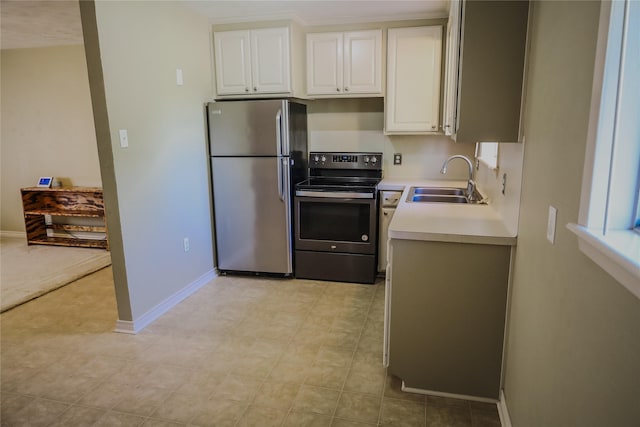 248 Ellis St, Rusk, TX 75785 - kitchen featuring stainless steel appliances, a sink, light countertops, and white cabinetry