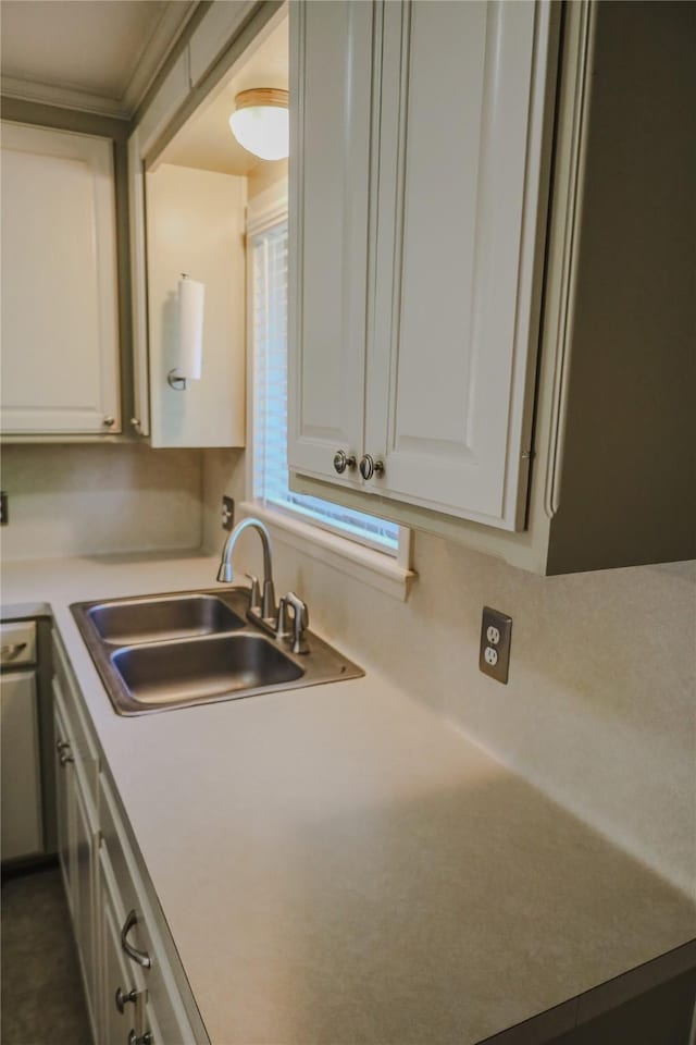 248 Ellis St, Rusk, TX 75785 - kitchen featuring a sink, white cabinets, and light countertops
