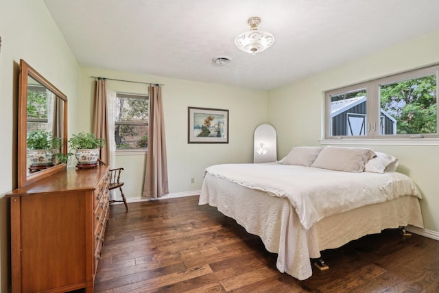 1113 Stanley St, Denton, TX 76201 - bedroom featuring dark wood finished floors and baseboards