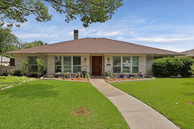 2612 Windsor Pl, Plano, TX 75075 - single story home featuring a chimney, a front yard, brick siding, and a shingled roof