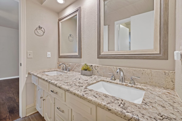 2612 Windsor Pl, Plano, TX 75075 - bathroom featuring double vanity and wood finished floors
