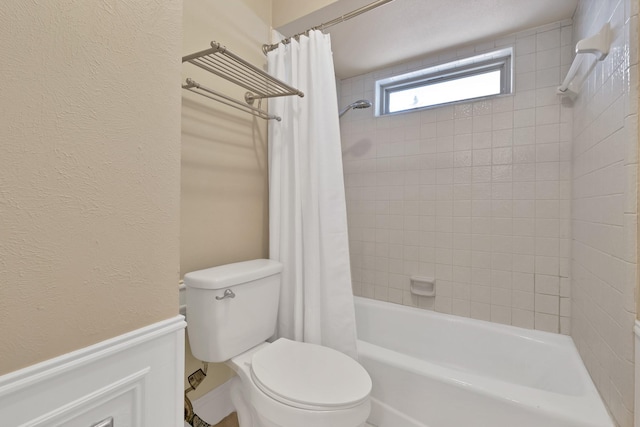 2612 Windsor Pl, Plano, TX 75075 - bathroom with shower / bath combo with shower curtain, toilet, and a textured wall