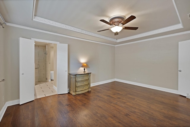 2612 Windsor Pl, Plano, TX 75075 - spare room featuring a raised ceiling, a ceiling fan, ornamental molding, wood finished floors, and baseboards