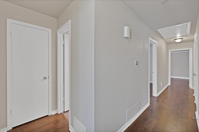 2612 Windsor Pl, Plano, TX 75075 - corridor featuring attic access, wood finished floors, and baseboards