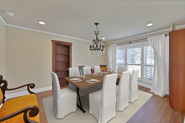 2612 Windsor Pl, Plano, TX 75075 - dining room with a chandelier, recessed lighting, wood finished floors, crown molding, and baseboards