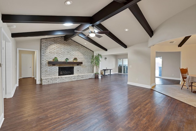 2612 Windsor Pl, Plano, TX 75075 - unfurnished living room featuring ceiling fan, wood finished floors, a fireplace, baseboards, and brick wall