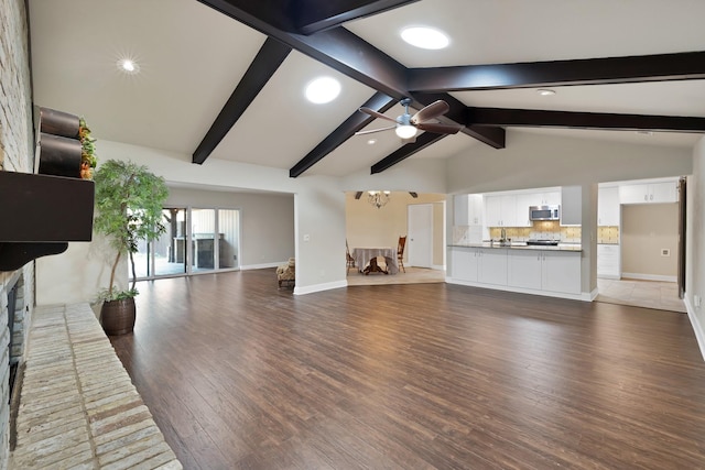 2612 Windsor Pl, Plano, TX 75075 - unfurnished living room with baseboards, a ceiling fan, wood finished floors, a brick fireplace, and recessed lighting