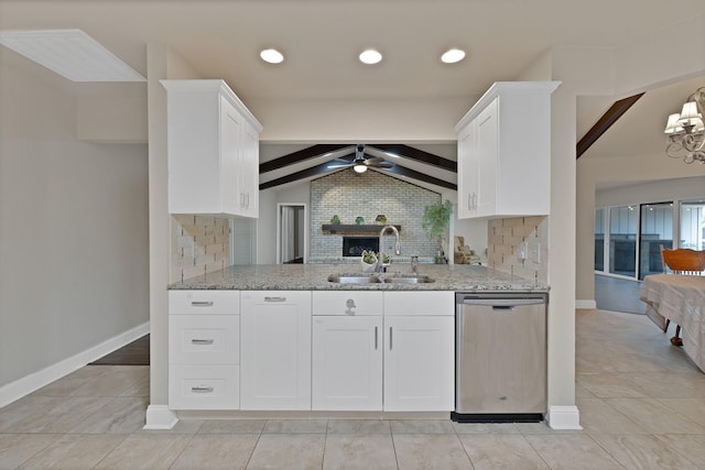 2612 Windsor Pl, Plano, TX 75075 - kitchen with a sink, stainless steel dishwasher, light stone countertops, tasteful backsplash, and white cabinets