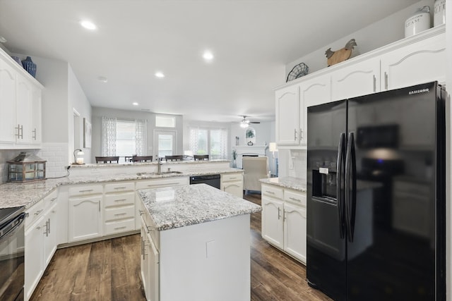 2408 Charisma Dr, Fort Worth, TX 76131 - kitchen featuring black appliances, a sink, decorative backsplash, a peninsula, and recessed lighting