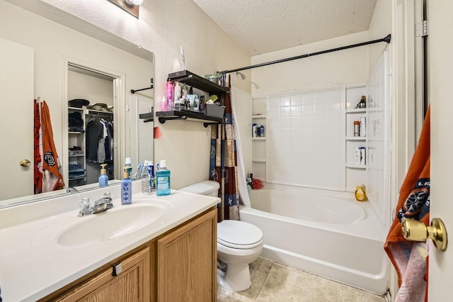 1806 Willowbrook Dr, Terrell, TX 75160 - bathroom featuring toilet, shower / bath combination with curtain, vanity, a textured ceiling, and a spacious closet