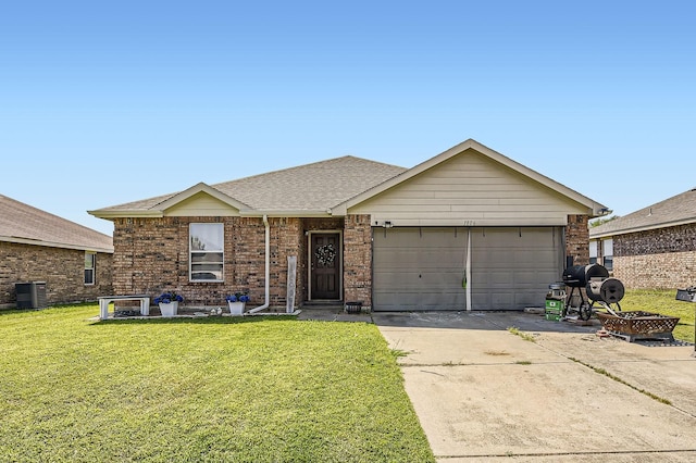 1806 Willowbrook Dr, Terrell, TX 75160 - ranch-style home featuring driveway, an attached garage, a front lawn, central air condition unit, and brick siding