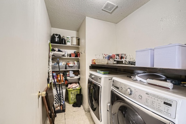1806 Willowbrook Dr, Terrell, TX 75160 - laundry area featuring washer and clothes dryer and a textured ceiling
