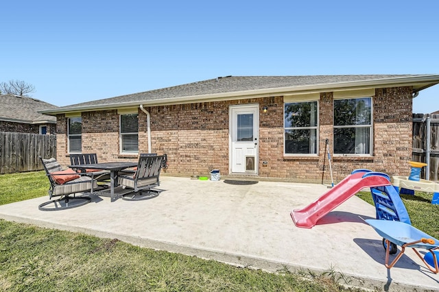 1806 Willowbrook Dr, Terrell, TX 75160 - rear view of property featuring a patio area, brick siding, and roof with shingles