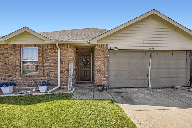 1806 Willowbrook Dr, Terrell, TX 75160 - ranch-style home featuring a front lawn, concrete driveway, a garage, a shingled roof, and brick siding