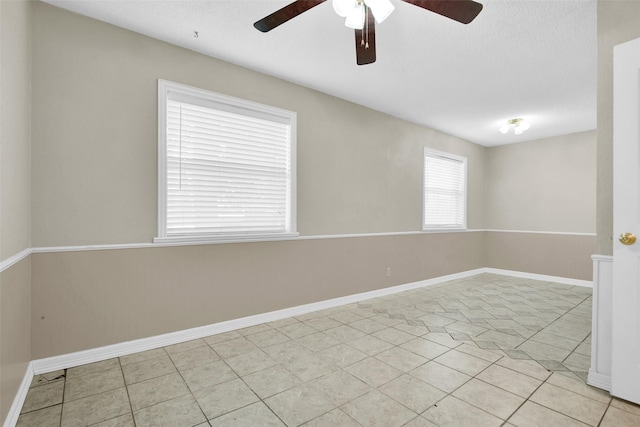 106 King Ave, Howe, TX 75459 - spare room featuring a ceiling fan, light tile patterned floors, and baseboards