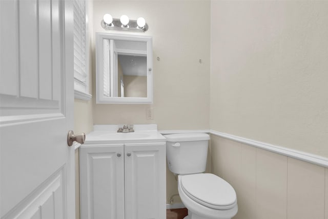 106 King Ave, Howe, TX 75459 - bathroom with vanity, toilet, and wainscoting