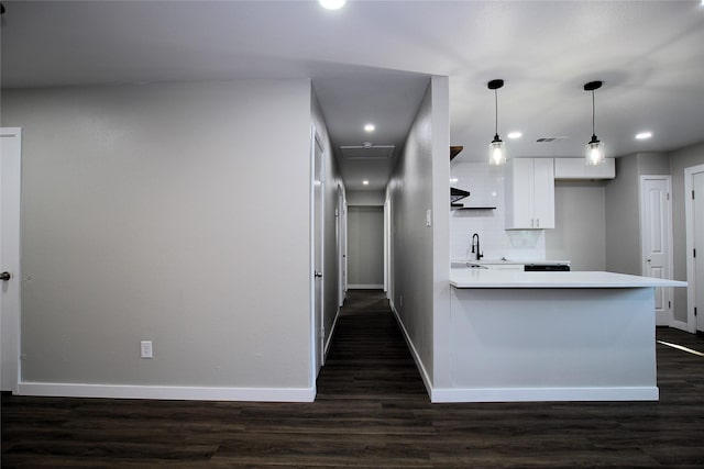 810 Laguna Dr, Garland, TX 75043 - kitchen featuring baseboards, white cabinets, a peninsula, light countertops, and recessed lighting