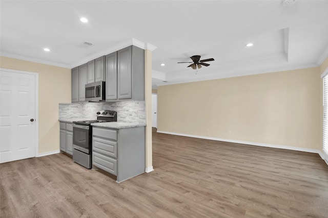 312 W Young St, Howe, TX 75459 - kitchen with gray cabinetry, appliances with stainless steel finishes, recessed lighting, ornamental molding, and tasteful backsplash