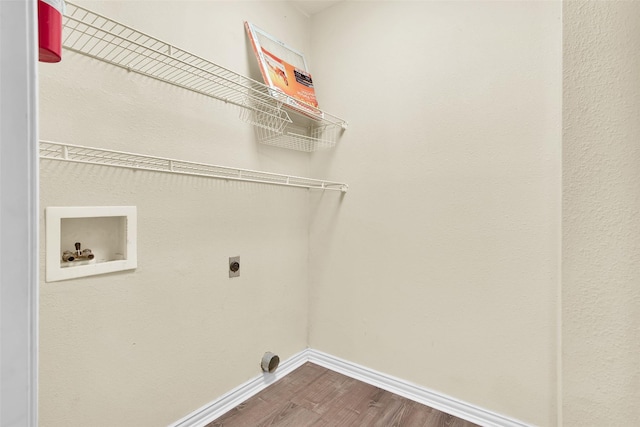 312 W Young St, Howe, TX 75459 - laundry room featuring electric dryer hookup, dark wood-style flooring, washer hookup, and baseboards