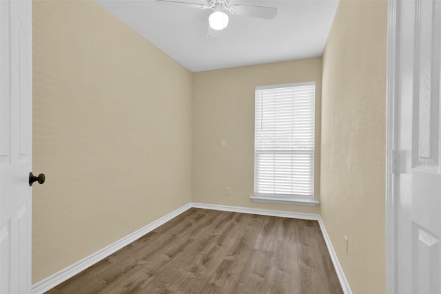 312 W Young St, Howe, TX 75459 - spare room with wood finished floors, ceiling fan, and baseboards