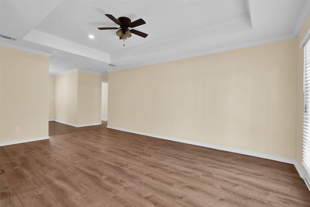 312 W Young St, Howe, TX 75459 - unfurnished room featuring a tray ceiling, crown molding, wood finished floors, ceiling fan, and baseboards