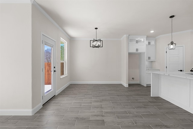 2325 Neches St, Granbury, TX 76048 - unfurnished dining area with ornamental molding, a chandelier, baseboards, recessed lighting, and wood finished floors