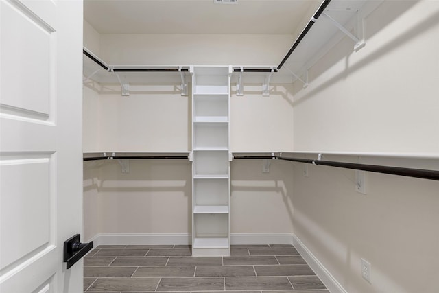 2325 Neches St, Granbury, TX 76048 - walk in closet featuring wood finish floors