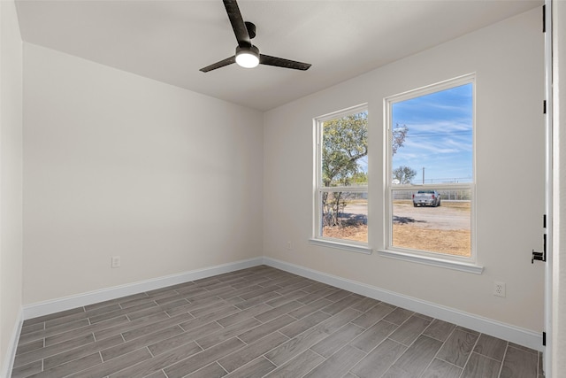 2325 Neches St, Granbury, TX 76048 - unfurnished room with wood tiled floors, baseboards, and a ceiling fan