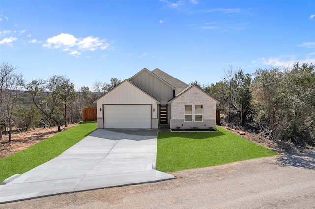 2325 Neches St, Granbury, TX 76048 - view of front facade featuring driveway, a garage, a front yard, and stone siding
