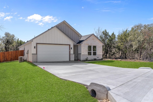 2325 Neches St, Granbury, TX 76048 - view of front facade featuring board and batten siding, cooling unit, a garage, and concrete driveway