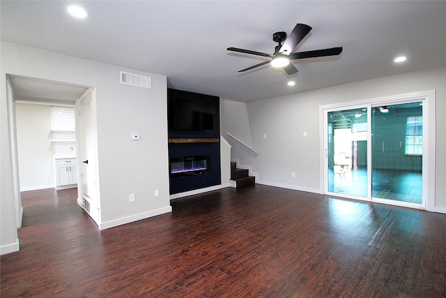 2202 Statler Dr, Carrollton, TX 75007 - unfurnished living room with ceiling fan, wood finished floors, a fireplace, baseboards, and recessed lighting