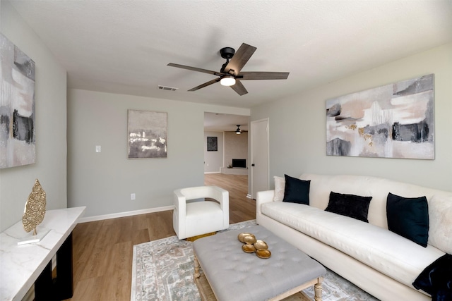 620 Admiralty Way, Fort Worth, TX 76108 - living area with ceiling fan, wood finished floors, and baseboards