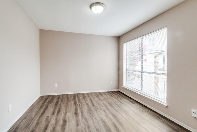 8110 Skillman St Unit 2054, Dallas, TX 75231 - spare room with wood finished floors and plenty of natural light
