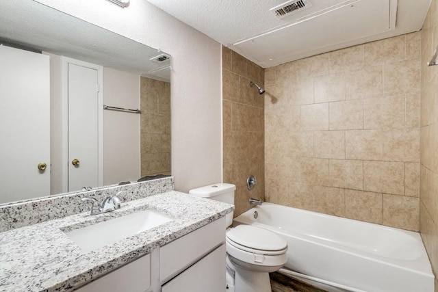 8110 Skillman St Unit 2054, Dallas, TX 75231 - bathroom with vanity, bathing tub / shower combination, and a textured ceiling