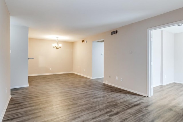 8110 Skillman St Unit 2054, Dallas, TX 75231 - empty room with a chandelier and wood finished floors