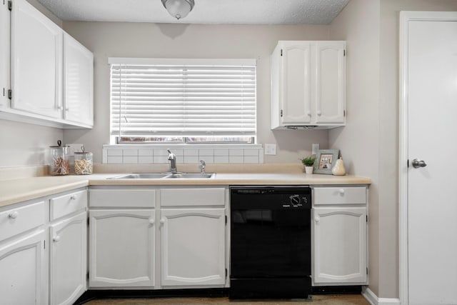 220 Timber Ridge Ln, Coppell, TX 75019 - kitchen with black dishwasher, a sink, white cabinetry, and light countertops