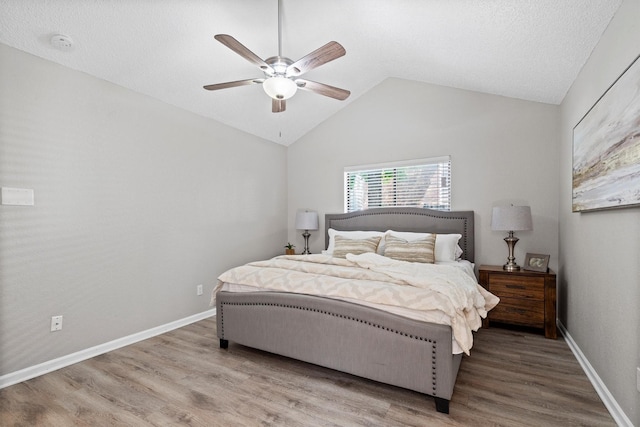 220 Timber Ridge Ln, Coppell, TX 75019 - bedroom featuring vaulted ceiling, wood finished floors, ceiling fan, and baseboards
