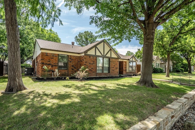 220 Timber Ridge Ln, Coppell, TX 75019 - tudor house featuring brick siding and central AC