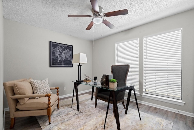 220 Timber Ridge Ln, Coppell, TX 75019 - office with a textured ceiling, ceiling fan, wood finished floors, and baseboards